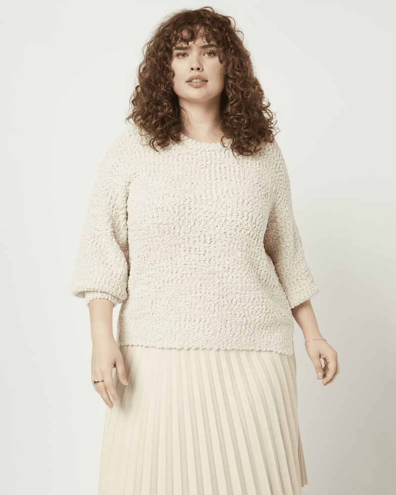 Front of a model wearing a size 1X Irena Popcorn Pullover Sweater in Ivory by East Adeline. | dia_product_style_image_id:210240